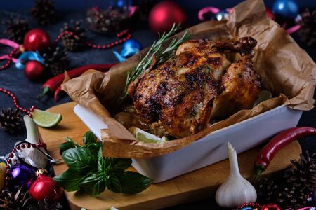Chicken baked in the oven with spices, lemon and herbs. A dish made for Christmas.の写真素材