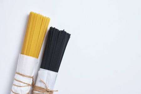 Black and white paste. Different types of spaghetti.