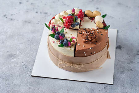 Assorted 4 different cakes. 4 flavors of cake in one box. Dessert for tasting or for a holiday in a gift design.の写真素材