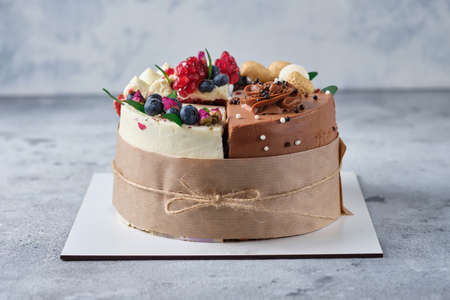 Assorted 4 different cakes. 4 flavors of cake in one box. Dessert for tasting or for a holiday in a gift design.の写真素材