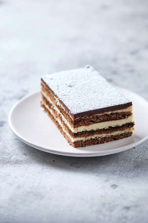 Morning breakfast with coffee and cake. Piece of cake on a plate