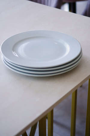 Table setting in the restaurant. Preparing the restaurant for the opening.の写真素材