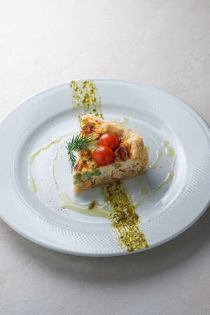 Menu for the restaurant: quiche with salmon.