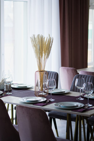 Table setting in the restaurant. Preparing the restaurant for the opening.の写真素材