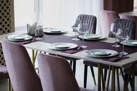 Table setting in the restaurant. Preparing the restaurant for the opening.の写真素材