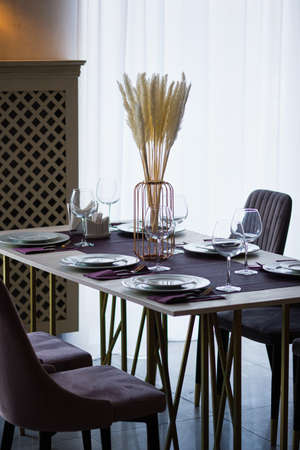 Table setting in the restaurant. Preparing the restaurant for receiving guests.の写真素材
