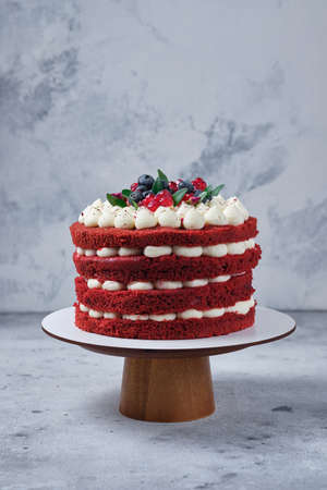 Sponge cake red velvet. Cake with cream cheese cream and raspberry filling.の写真素材