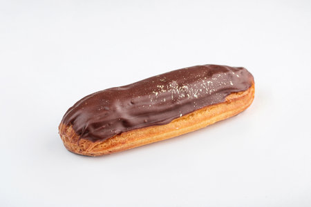 Chocolate Eclair adorned with a Glossy Topping that catches the eye and entices taste budsの写真素材