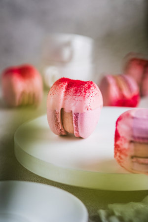 Pink macaron cake with strawberry creamの写真素材