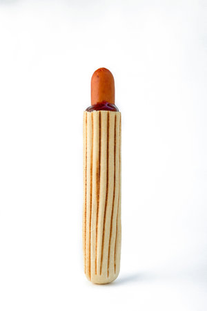 Hot dog on a white background. Bun with ketchup and sausageの写真素材