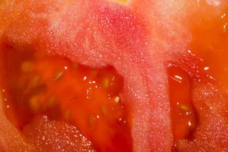 the red juicy pulp of tomato macroの写真素材
