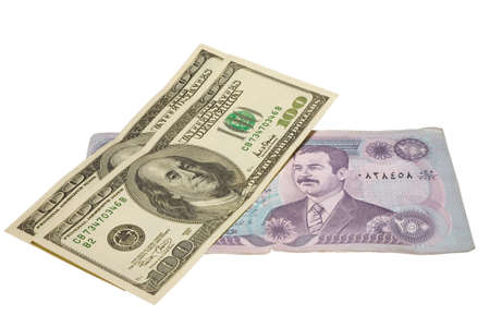 US dollars banknotes over iraq dinars with clipping path