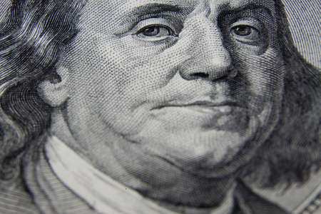 the part of US dollars banknote with president's portraitの写真素材