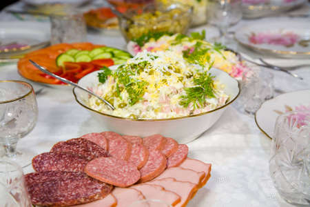 the table with various food and dishesの写真素材