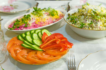the table with various food and dishesの写真素材