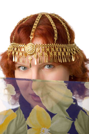 the young pretty woman with gold adornmentの写真素材