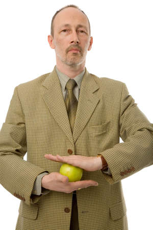 the senior man with green apple on white backgroundの写真素材
