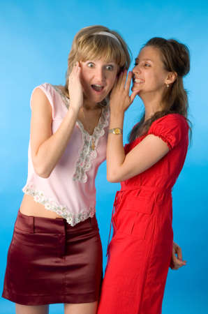 the two young women on blue background
