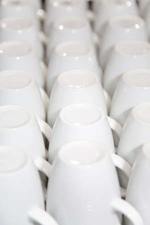 the rows of white porcelain cups, close-upの写真素材