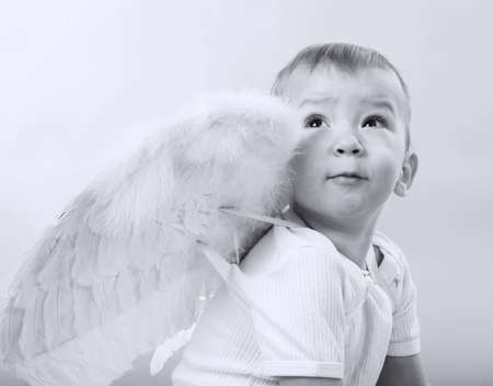 small boy dressed as Cupid, black and white, blue toneの写真素材