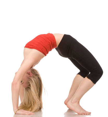young woman makes exercises on a white background