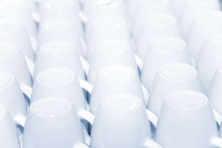 the rows of white porcelain cups, close-upの写真素材