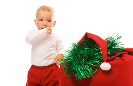small boy and red box with presents on white backgroundの写真素材