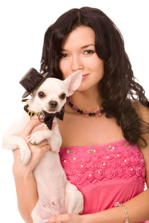 closeup portrait of a young brunette woman with dog on white backgroundの写真素材