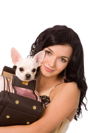 closeup portrait of a young brunette woman with dog on white backgroundの写真素材