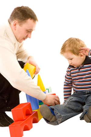 portrait of the young boy playing with father isolated on a white backgroundの写真素材