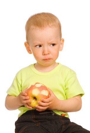 small boy with apple on a white backgroundの写真素材