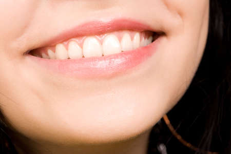attractive smile of the beautiful young woman