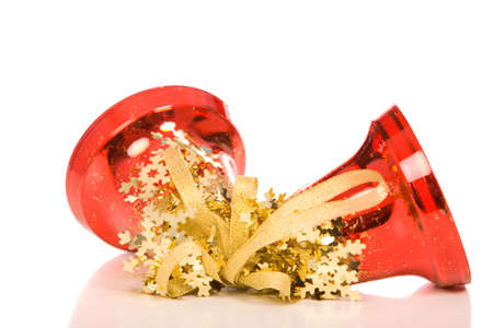 closeup photo of the red christmas bells with bounce on a white backgroundの写真素材