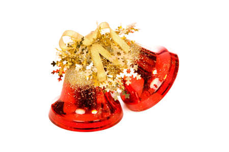 closeup photo of the christmas bells with shadow on a white backgroundの写真素材