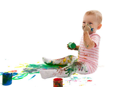 portrait of the little boy covered with bright paintの写真素材