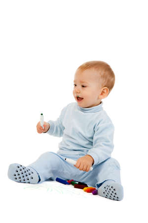 portrait of the little boy painting with crayonsの写真素材