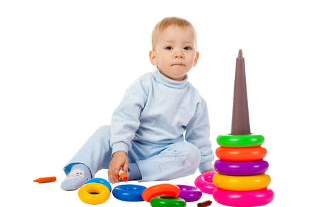 boy playing with the educational toy isolated on white backgroundの写真素材