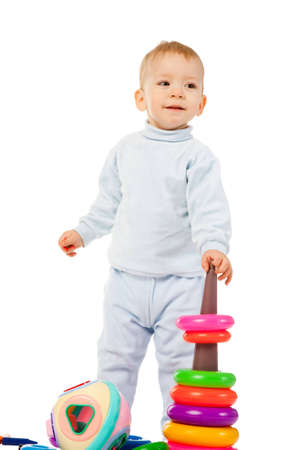 young boy playing with the educational toy isolated on white backgroundの写真素材