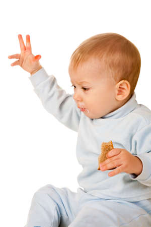 young boy has a bite isolated on white backgroundの写真素材