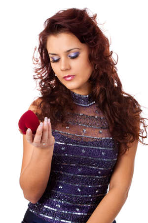 closeup portrait of the young pretty woman with jewelry box on white backgroundの写真素材