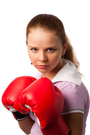portrait of the young woman in boxing gloves on white backgroundの写真素材
