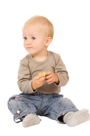 little boy play with shell. isolated on a white backgroundの写真素材