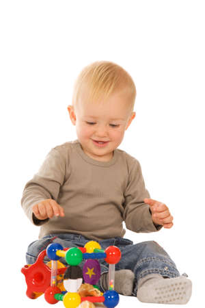 little boy play with toys. isolated on a white backgroundの写真素材