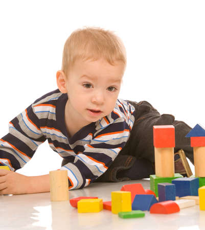 little boy play with bricksの写真素材