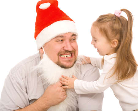 small girl and the man dressed in christmass dressの写真素材