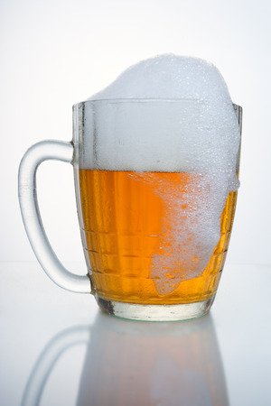 Russian Soviet beer mug. With droplets of condensate, with a cap of foam and the drip foam. Such beer mugs were all pubs Soviet Union.の写真素材