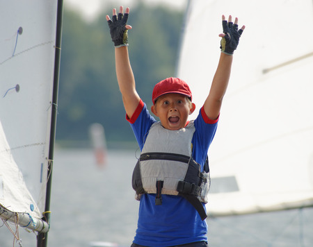 Young yachtsman joy over the victory.の写真素材