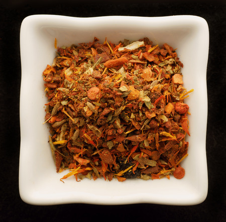 Spice for pilaf in a ceramic bowl. Isolated on black.の写真素材