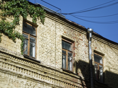 old brick house in summer in Moscow, Russiaの写真素材