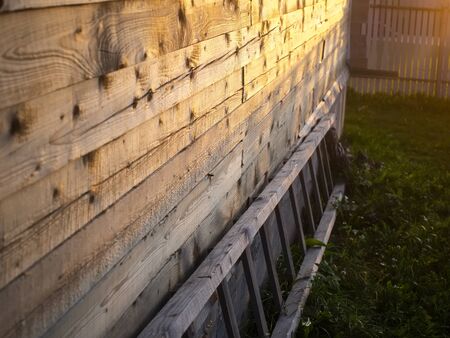 sunlight on the wall of a wooden house, Russiaの写真素材